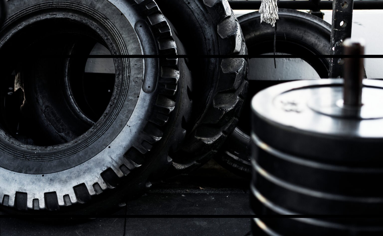 Photo of black big tires on wheels for large cars.